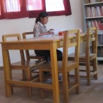 Maribel reading in the library