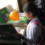 web6 A girl reading in the new library