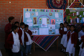 4th grade class presenting their educational poster about children's rights and duties.